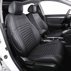 the interior of a car with black leather seats