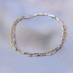 D E T A I L S * Materials: 14k gold fill // 925 sterling silver * Clasp: 3x8 mm lobster clasp * Paperclip chain: 2x5.5 mm  * Figaro chain: 1.5 mm  This bracelet is ultra dainty and perfect for layering! Now available in all gold and silver C A R E Gold filled jewelry is very durable and will resist tarnish for years if properly cared for. It contains 100 times more gold than plated pieces. * Allow lotions and perfumes to soak in prior to wearing * Remove before showering, swimming, and exercisin Dainty Gold Sterling Silver Bracelet For Everyday, Dainty Silver Gold Jubilee Bracelet, Gold Link Sterling Silver Bracelet In Minimalist Style, Gold Sterling Silver Link Bracelet Minimalist Style, Minimalist Gold Sterling Silver Link Bracelet, Gold Sterling Silver Box Chain Bracelet Gift, Gold Sterling Silver Box Chain Bracelet, Gold Sterling Silver Bracelet With Adjustable Chain For Everyday, Gold Sterling Silver Oval Link Bracelet Gift