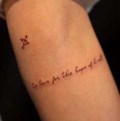 a tattoo saying to live for the love of god on someone's left arm