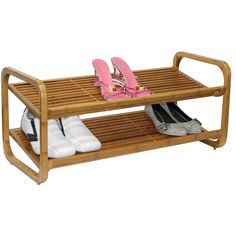 a wooden shoe rack with two pairs of shoes on it and one pair of slippers