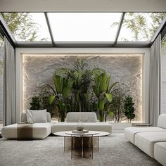 a living room filled with white furniture and plants