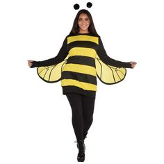 a woman in a bee costume is walking with her arms out and legs spread wide