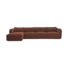 a brown sectional couch with pillows on it's back and the seat facing outward