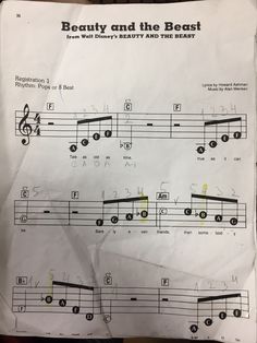 sheet music with notes for beauty and the beast written in black on top of it