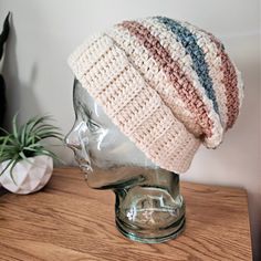 a knitted hat sitting on top of a mannequin head