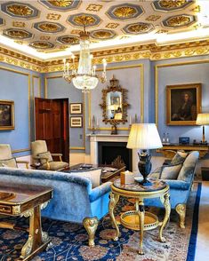 a living room filled with furniture and a chandelier