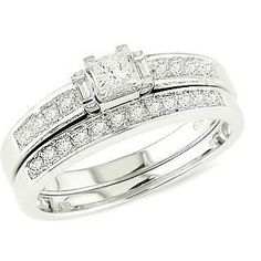 a white gold wedding ring set with princess cut diamonds