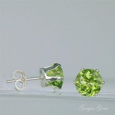 "Peridot is a beautiful bright lime green genuine gemstone which is natural and untreated. These are clear and sparkling large 7mm round 2.80ctw Peridots which are set into sterling silver castings with butterfly backs. Peridot is a birthstone for August. The cut and clarity of these gemstones is excellent. The \"model\" for the earrings is only a photograph, not a real person wearing the earrings. The ear is scaled to an average sized ear. Peridot Lore: Peridot was known as the \"gem of the sun Green Brilliant-cut Earrings For May Birthstone, Green Brilliant Cut Earrings For May Birthstone, Green Round Earrings With Prong Setting, Green Brilliant Round Cut Earrings, Classic Green Peridot Earrings, Classic Green Round Earrings, Classic Green Round Cut Earrings, Green Round Cut Earrings As Gift, Green Gemstone Earrings