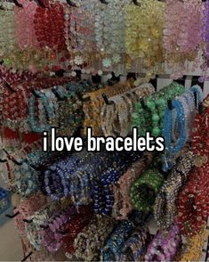 many bracelets are on display with the words i love bracelets