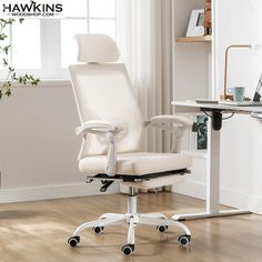 a white office chair sitting on top of a hard wood floor next to a window