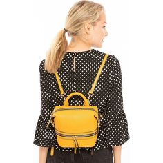 The Ashley yellow leather backpack is a fun and practical alternative to your traditional designer handbags. Made with genuine pebble leather, gold zippers, and fashionable leather tassels. Can be easily converted to a crossbody making this your new go-to bag. It includes a zipped front pocket, back pocket, middle compartment, and a cell phone slot. OUTSIDE: Yellow INTERIOR: Red HARDWARE: Gold WIDTH: 7.4" HEIGHT: 7.6″ DEPTH: 4.6″ STRAP DROP: 13"-21″ Trendy Leather Crossbody Backpack With Zipper Closure, Trendy Leather Crossbody Backpack With Zipper, On-the-go Yellow Shoulder Bag With Zipper Closure, Trendy Gold Backpack For Everyday Use, Modern Yellow Bag With Zipper Closure, Modern Yellow Bags With Zipper Closure, Trendy Yellow Backpack With Adjustable Strap, Yellow Zipper Closure Backpack Shoulder Bag, Yellow Leather Travel Backpack With Adjustable Strap