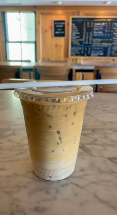 a plastic cup sitting on top of a table