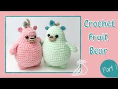 two crocheted stuffed animals sitting next to each other on a pink and white background