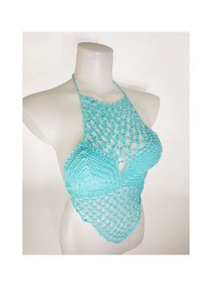 a white mannequin wearing a blue crochet halter