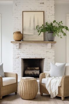 a living room with two wicker chairs and a fire place in front of a brick fireplace