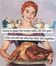 a woman holding a plate with a turkey on it