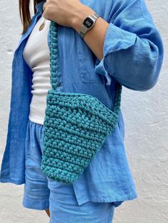 This shoulder bag is completely hand crocheted from a cord of recycled cotton 🌎 It's quite roomy, in the photo you can see sunglasses case, phone and headphones inside the bag. Ships in a cotton bag and would be great for gifting 💝 Can be made in six colors: turquoise, pastel purple, linen, brown, pink, pastel green. 🧵Please note that as the item is handmade, the sizes are approx: Height (at the highest part): 21 cm Width (at widest part): 18 cm Bottom diameter: 9 cm Handle length: 90 cm The photos shows a sample of a finished bag. Please remember that color reproduction depends on the screen settings 🖥️ Casual Hand Knitted Shoulder Bag, Casual Everyday Hand Knitted Shoulder Bag, Casual Yarn Shoulder Bag For Daily Use, Trendy Cotton Crochet Bag For Everyday, Trendy Everyday Cotton Crochet Bag, Casual Everyday Yarn Shoulder Bag, Cotton Crochet Bag With Adjustable Strap, Handmade Cotton Crochet Bag, Trendy Handmade Cotton Crochet Bag