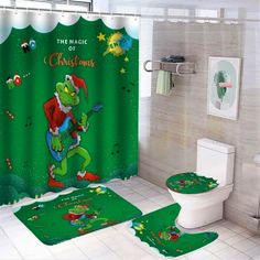 a bathroom with a shower curtain and rugs in the shape of cartoon characters on it