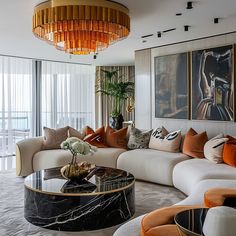 a living room filled with furniture and a chandelier