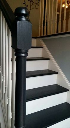 black and white stairs leading up to the second floor