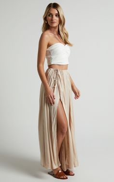 Under The Twilight Maxi Skirt - Thigh Split Skirt in Beige | Showpo USA Beige Flowy Maxi Skirt For Summer, Flowy Beige Bottoms For Beach, Flirty Flowy Skirt With Elastic Waistband, Beige Tiered Lined Skirt, Flowy Asymmetrical Beige Maxi Skirt, Flowy Beige Skirt With Elastic Waistband, Beige Flowy Asymmetrical Maxi Skirt, Beige Flowy Skirt With Elastic Waistband, Neutral Flowy Lined Skirt