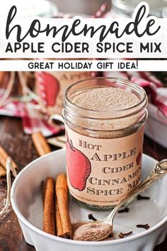 homemade apple cider spice mix in a glass jar with cinnamon sticks on the side