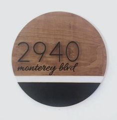 a wooden plaque with the number 2400 montgomery blvd