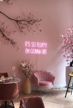 a room with pink chairs and flowers on the wall, it's so fluffy i'm gona die