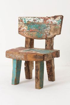 an old wooden chair sitting on top of a white floor