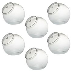 six clear glass jars with lids on each one