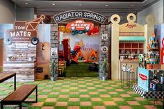 the interior of a toy store with green carpet and checkered flooring on display