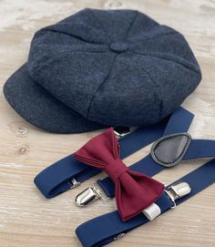 Your special guy will look so handsome when he shows up in his Cabernet Wine bow tie , wool navy newsboy cap and matching navy suspenders . Great set for groomsman, best man or ring bearers - This set is a great choice for family photos, wedding, ring bearer outfit, birthday celebration or any other special occasion.  Please  contact us about FREE COLOR SAMPLES ! Each bow tie comes pre-tied and made with adjustable strap . You can also write the note for your order if you need ALLIGATOR CLIP or Navy Blue Burgundy Ring Bearer, Wedding Ring Bearer Outfit, Wedding Ring Bearer, Suspenders Wedding, Flat Hat, Outfit Birthday, Bearer Outfit, Ivy Cap, Ring Bearers