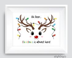 a reindeer with christmas lights on it's antlers is shown in a white frame