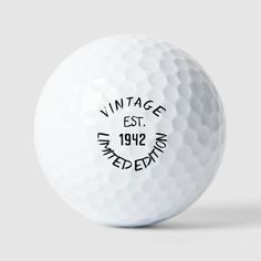 a white golf ball with the words vintage east on it's front and side