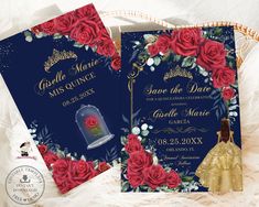 two wedding cards with red roses on them and a snow globe in the middle, sitting next to each other