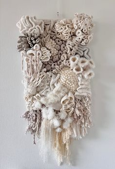 a wall hanging made out of various objects