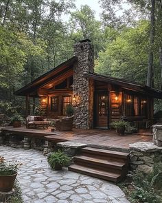 a log cabin in the woods with steps leading up to it's front door