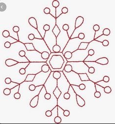 a snowflake is shown in red ink on a white background, it appears to be an ornament