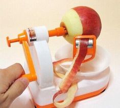 an apple slicer is being used to peel an apple