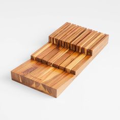 three pieces of wood sitting on top of each other