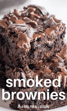 a close up of two brownies on a plate with the words smoked brownies