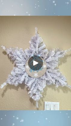 the snowflake is hanging on the wall