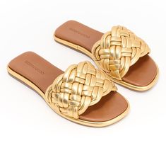 A beautiful blend of leisurely and luxurious looks, this leather sandal's woven slip-on design goes from poolside to patio party in a fashionable flash. From Bernardo. Luxury Woven Leather Sandals For Vacation, Luxury Synthetic Sandals For The Beach, Luxury Synthetic Beach Sandals, Luxury Woven Leather Sandals For Summer, Gold Woven Leather Sandals For Summer, Elegant Woven Leather Sandals For Beach, Luxury Slide Sandals For Beach, Chic Summer Woven Leather Slides, Luxury Beach Slide Sandals