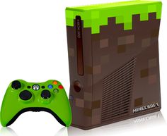 a video game console with a green controller next to it's packaging box and cover