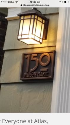 a lamp on the side of a building that reads 150 madison marie, but everyone at atlas