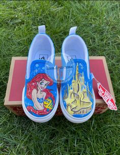 White Canvas Vans (Slip-on) customized with Little Mermaid Ariel, Flounder and castle! My custom designs are personalized and styled to create one-of-a-kind pieces for my customers.  All shoes are hand-painted by myself. Made with acrylic paint. They are finished with a permanent sealing varnish for protecting the artwork and also with waterproof to ensure longevity of the product. Feel free to browse around my shop if you're interested in my artwork or any other customized item! Customizations may be available upon request. The price will be provided once designs are finalized. All products are made in a smoke free environment. Please do not hesitate to contact me at any point if you have questions. Vans Shoes Custom, Painted Wedding Shoes, Van Shoes, Custom Painted Shoes, Disney Shoes, Shoes Custom, Sneakers Athletic, Vans Slip On, Vans Off The Wall