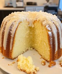 a bundt cake with white frosting on a plate