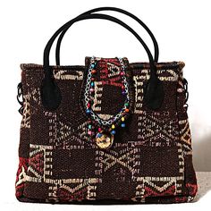 HANDMADE TRADITIONAL ANTIQUE Shabbystyle Anatolian Kilim Bag is a unique handmade product woven on Anatolian carpet and kilim looms. The leather parts are made of genuine leather and the inner parts are made of high quality thick waterproof fabric. It has a 22x15 zippered compartment inside. Can be used as handbag and shoulder bag. Its large interior volume has the capacity to meet your daily needs. This bag is a part of a carpet which weaved in somewhere of Anatolia. So there is no bag exactly Bohemian Woven Handheld Shoulder Bag, Handheld Woven Bohemian Shoulder Bag, Bohemian Style Shoulder Bag For Market, Bohemian Shoulder Bag For Market, Bohemian Handheld Shoulder Bag, Bohemian Handheld Hobo Bag For Travel, Bohemian Brown Woven Hobo Bag, Bohemian Brown Woven Shoulder Bag, Bohemian Handwoven Satchel Bag