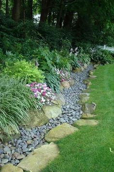 there is a picture of a garden with rocks and flowers in it that says, bonne soiree