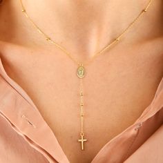 "This lovingly handcrafted 14K Solid Gold Satellite Chain Rosary Cross Necklace, Dainty Lariat Virgin Mary and Cross Dew Drops Y Necklace makes the perfect gift for mothers, Gift for sisters, Gift For Christmas, and friends. Featuring a Virgin Mary medal, and a cross pendant, this delicate looking necklace is both elegantly designed, and religiously infused. D E T A I L S * 100% 14K(585) Real Gold (no gold-filled or no gold plated material) * Chain on ball diameter: 2.60 mm * Cross Height: 1.30 Dainty Gold Handmade Lariat Necklace, Dainty Handmade Gold Lariat Necklace, Cross Shaped Beaded Chain Necklace Gift, Cross Shaped Beaded Chain Necklace For Gift, Cross-shaped Beaded Chain Necklace For Gift, Cross Shaped Beaded Chain Necklace As Gift, Yellow Gold Lariat Necklace With Lobster Clasp As Gift, Dainty Handmade Lariat Necklace As Gift, Handmade Dainty Lariat Necklace For Gift